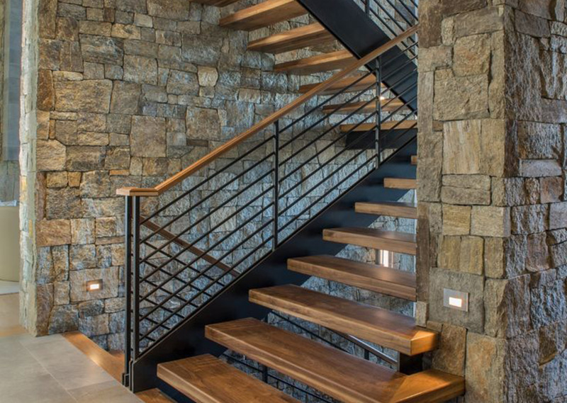 Interior stone feature wall and fireplace